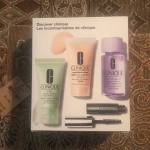 NWT Discover Clinique 4 piece set. Scrub cream, moisture surge, remover, mascara